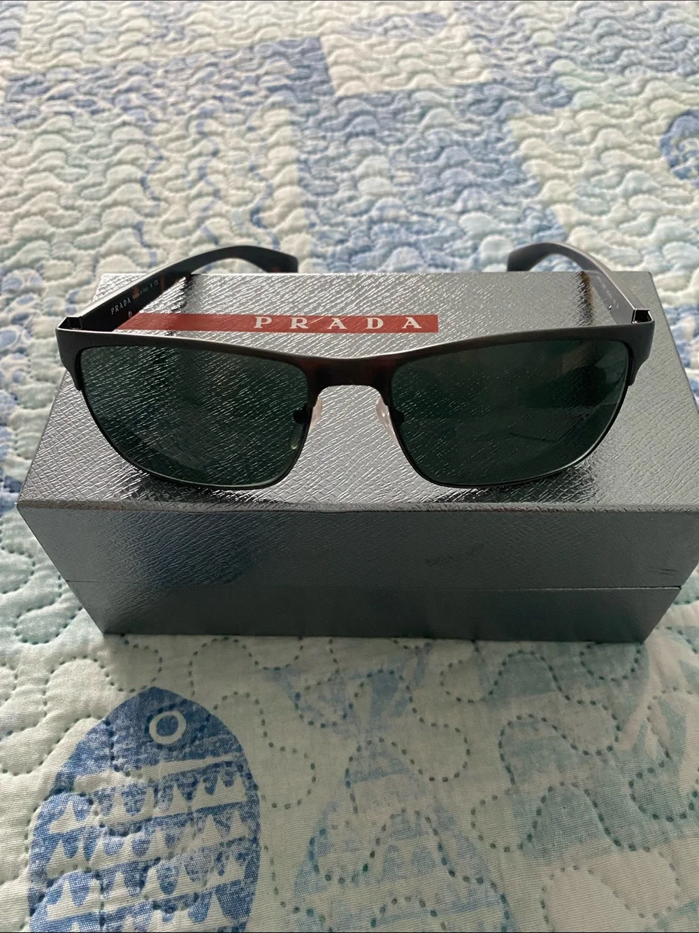 Prada Black Frame Sunglasses with Dark Green Lenses